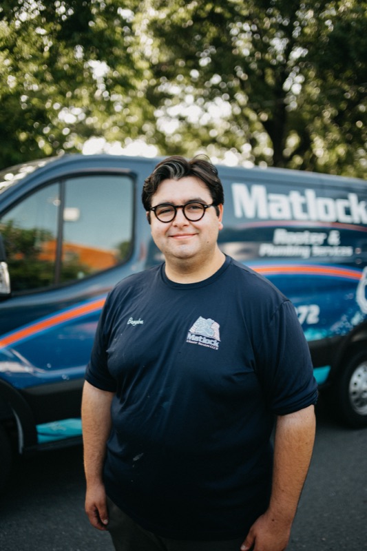 Matlock team member with glasses, friendly portrait
